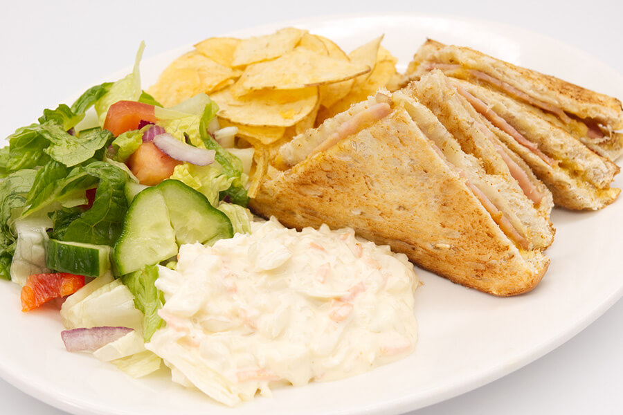 ham toastie with salad and coleslaw