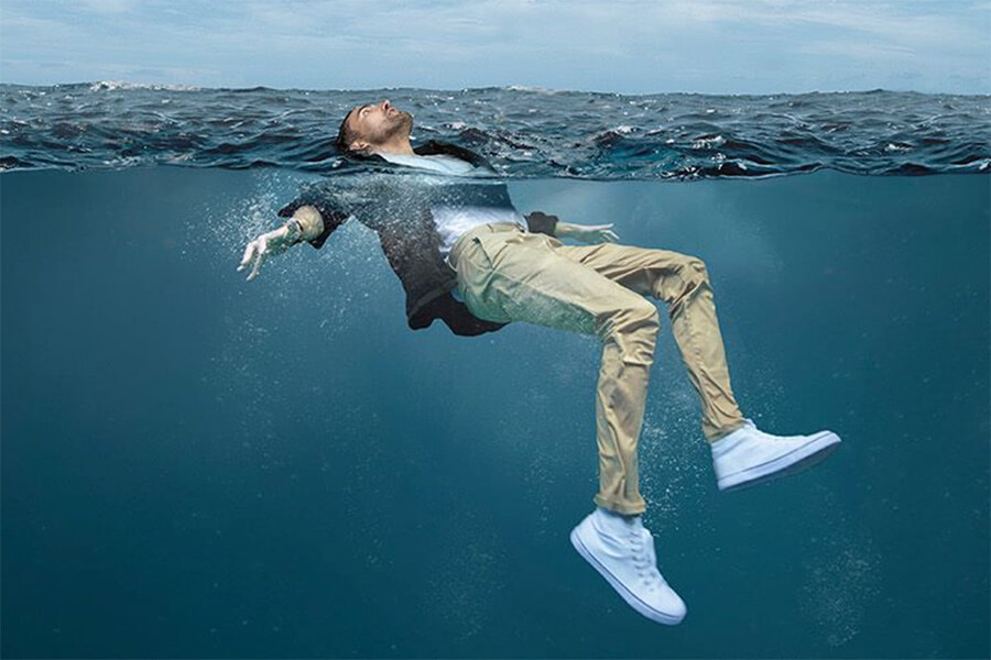 man floating in water