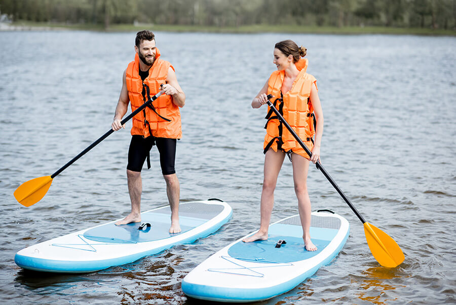 two people paddleboarding